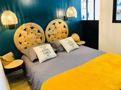 Un ou plusieurs lits dans un hébergement de l'établissement Joli studio cosy
