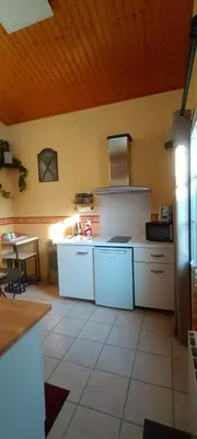 Cuisine ou kitchenette dans l'établissement Charmante petite dépendance
