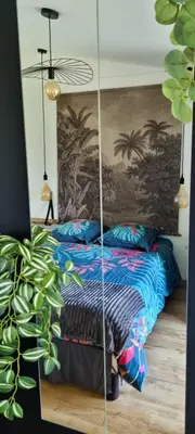 Un ou plusieurs lits dans un hébergement de l'établissement Ty Grain de Sel : logement privatif avec piscine, jardin et patio