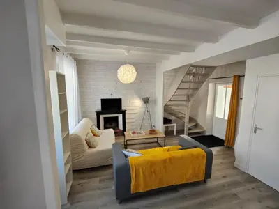 Coin salon dans l'établissement Charmante maison de Ville , 4 personnes , LES HERBIERS