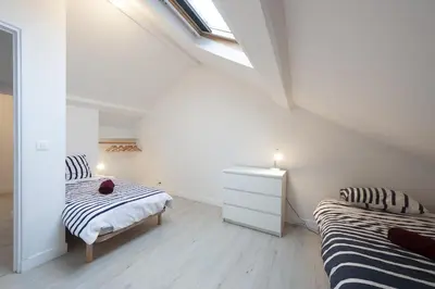 Un ou plusieurs lits dans un hébergement de l'établissement grand gîte terrasse vue Loire et château d'Ancenis