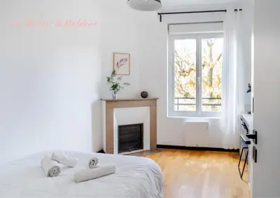Un ou plusieurs lits dans un hébergement de l'établissement Nouveau ! Ptit Lu - Appartement proche Loire