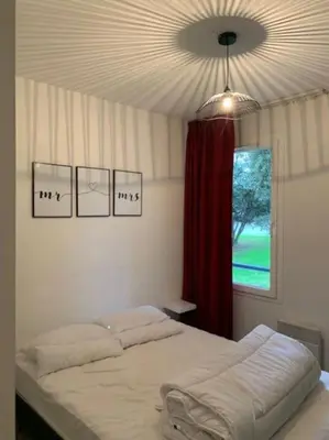 Un ou plusieurs lits dans un hébergement de l'établissement Agréable appartement dans Résidence à Pornichet