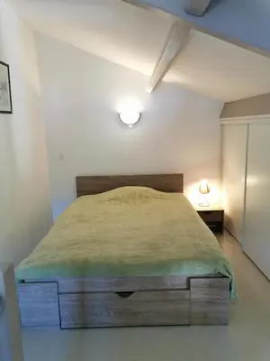 Un ou plusieurs lits dans un hébergement de l'établissement Le Cosy d'Eden
