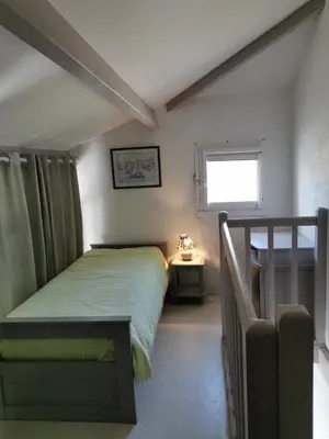 Un ou plusieurs lits dans un hébergement de l'établissement Le Cosy d'Eden