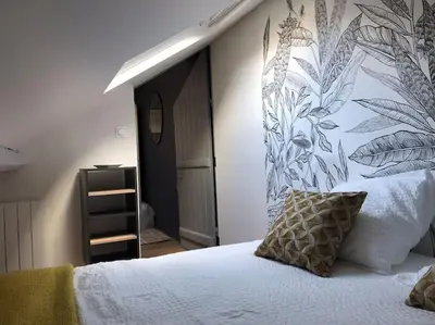 Un ou plusieurs lits dans un hébergement de l'établissement Appartement en cœur de ville