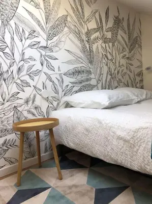Un ou plusieurs lits dans un hébergement de l'établissement Appartement en cœur de ville