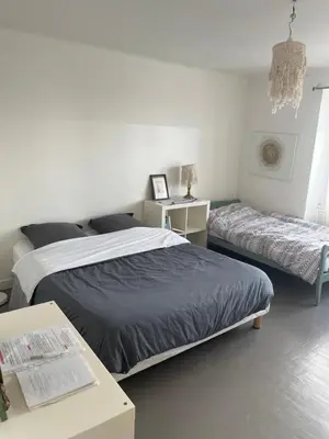 Un ou plusieurs lits dans un hébergement de l'établissement La maison sur la falaise