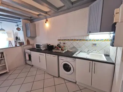 Cuisine ou kitchenette dans l'établissement L'Authentique - Les Maisons de Madeleine