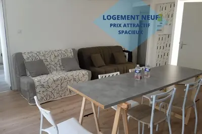 Coin salon dans l'établissement Le Cocon Familial - Dormir Comme A La Maison -