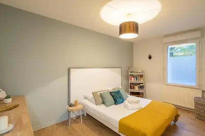 Un ou plusieurs lits dans un hébergement de l'établissement Sérénité - 2 chambres - Calme et Verdure