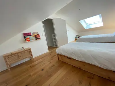 Un ou plusieurs lits dans un hébergement de l'établissement Maisonnette confortable à Pornic