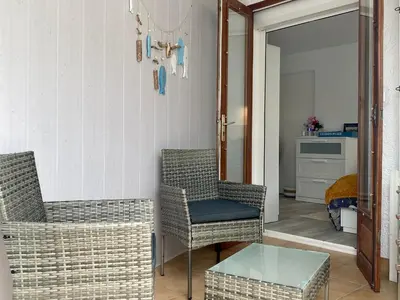 Coin salon dans l'établissement Appartement Confort avec Suite Parentale et Équipements pour Bébé à Saint-Michel-Chef-Chef - FR-1-306-1232