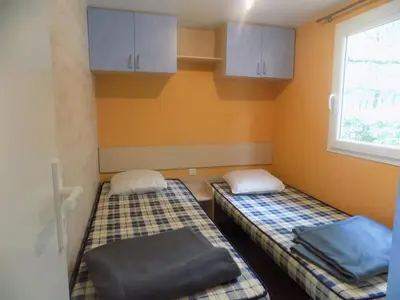 Un ou plusieurs lits dans un hébergement de l'établissement Mobil-home 6 personnes 3 chambres