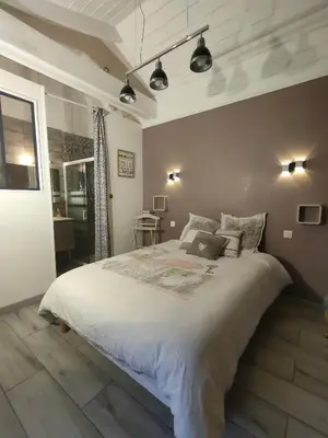 Un ou plusieurs lits dans un hébergement de l'établissement Jolies Chambres familiales à 10 minutes du Puy du Fou