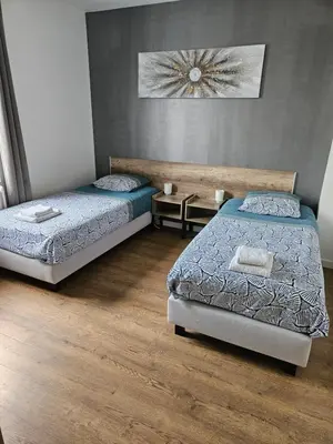 Un ou plusieurs lits dans un hébergement de l'établissement Maison Deluxe, moderne, calme, terrasse, proche chantiers de l'Atlantique et Airbus