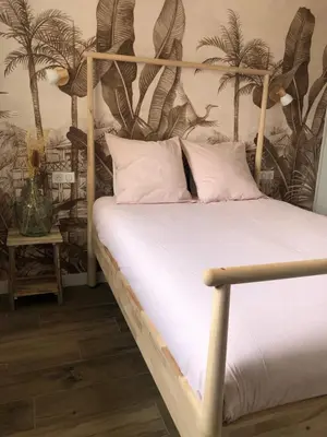 Un ou plusieurs lits dans un hébergement de l'établissement Face à la mer, bel appartement