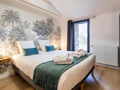 Un ou plusieurs lits dans un hébergement de l'établissement Ancienne grange rénovée près de Nantes avec spa et jardin - FR-1-306-1233