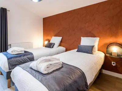 Un ou plusieurs lits dans un hébergement de l'établissement Ancienne grange rénovée près de Nantes avec spa et jardin - FR-1-306-1233