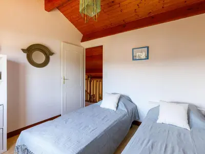Un ou plusieurs lits dans un hébergement de l'établissement Holiday Home Le Predaire by Interhome