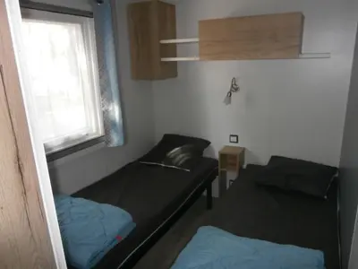 Coin salon dans l'établissement Mobilhome 3 chambres tout confort, proche de la plage