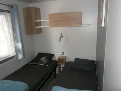 Coin salon dans l'établissement Mobilhome 3 chambres tout confort, proche de la plage