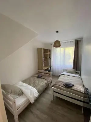 Un ou plusieurs lits dans un hébergement de l'établissement Gite de Tréguilly 4 chambres