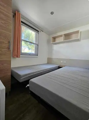 Un ou plusieurs lits dans un hébergement de l'établissement Superbe Mobil home 6-8 personnes (57)