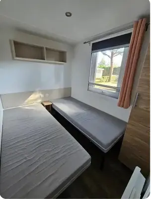 Un ou plusieurs lits dans un hébergement de l'établissement Superbe Mobil home 6-8 personnes (57)