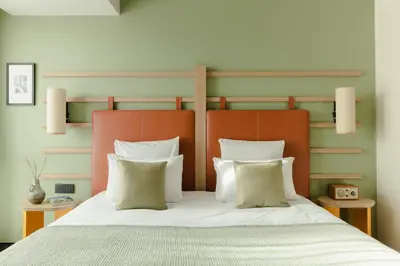 Un ou plusieurs lits dans un hébergement de l'établissement Hôtel Parc du Landreau
