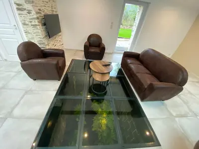 Coin salon dans l'établissement « Le Chai » Charme, Spa et massages en vignoble