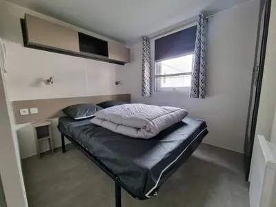 Un ou plusieurs lits dans un hébergement de l'établissement Joli mobil home 4-6 personnes 416