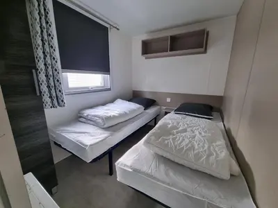 Un ou plusieurs lits dans un hébergement de l'établissement Joli mobil home 4-6 personnes 416
