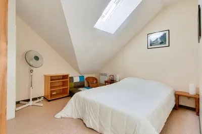 Un ou plusieurs lits dans un hébergement de l'établissement À deux pas de la plage, jolie maison pour 4