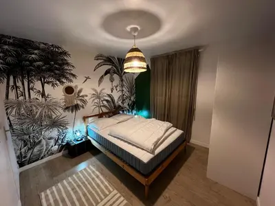 Un ou plusieurs lits dans un hébergement de l'établissement Maison familiale 4 chambres avec jardin et piscine
