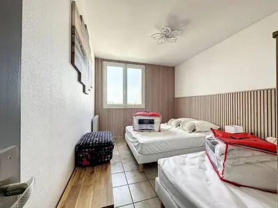Un ou plusieurs lits dans un hébergement de l'établissement Bord de mer vue panoramique avec parking privé